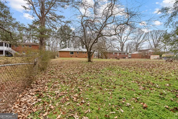a view of a yard with some trees