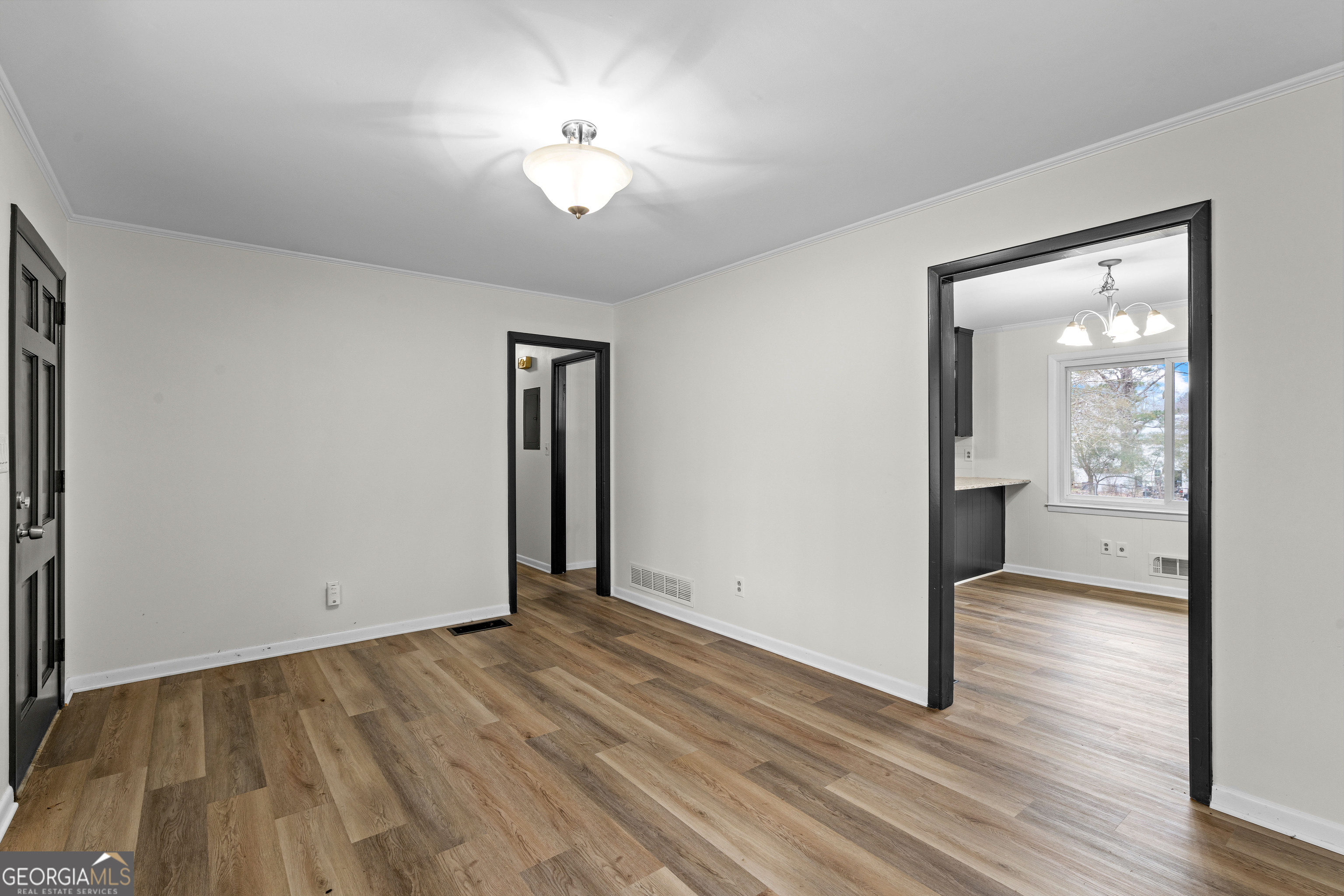 3548 Meadowview Court Rex, GA 30273 - Photo 8 of 41 an empty room with wooden floor and a ceiling fan