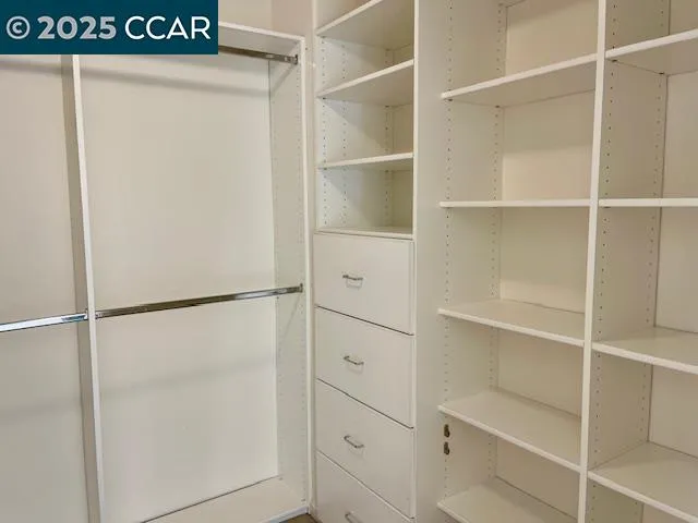 a view of an empty walk in closet