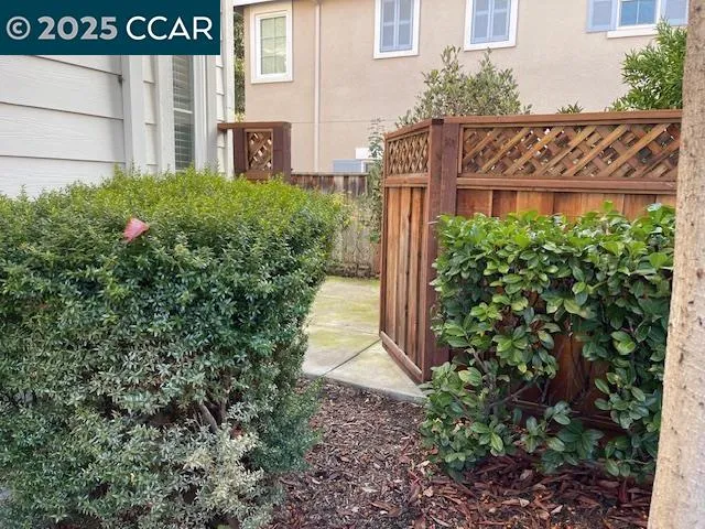 a view of a house with a small yard and plants