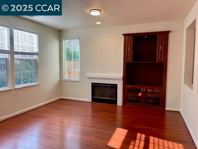 an entryway with a door and a fireplace