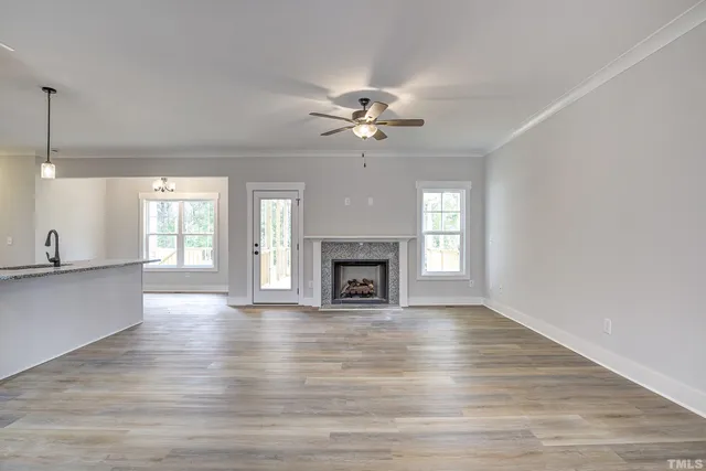 a kitchen with granite countertop white cabinets and a stove