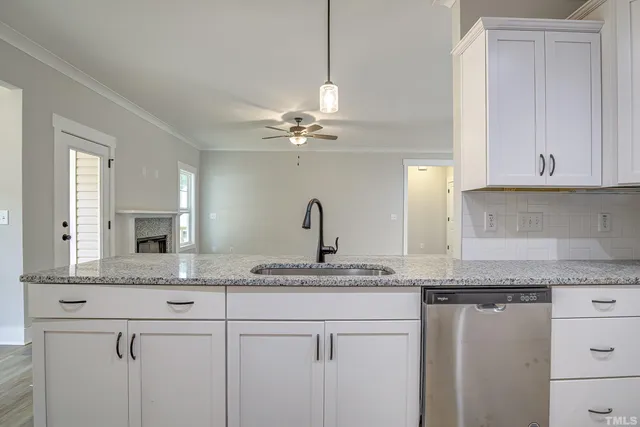 a white bath tub sitting next to a white sink