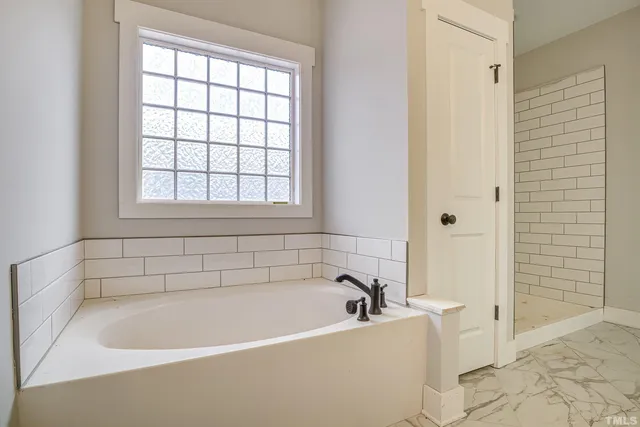 a view of a porch with wooden floor and outdoor space