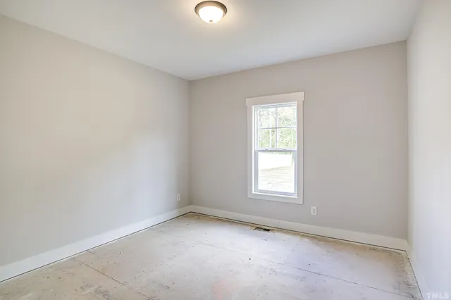 a swimming pool with trees in the background