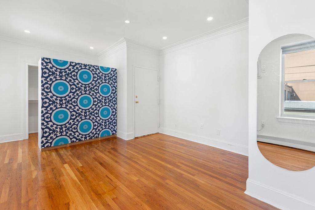 422 Grand Street, Unit 3 Hoboken, NJ 07030 - Photo 12 of 28 a view of an entryway with wooden floor