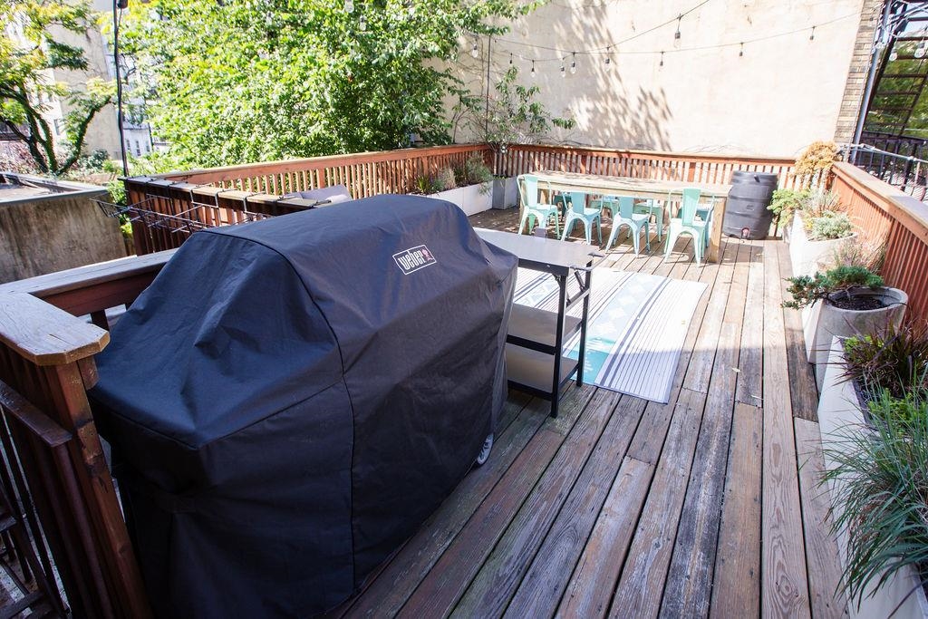 422 Grand Street, Unit 3 Hoboken, NJ 07030 - Photo 20 of 28 a view of balcony with wooden floor and outdoor seating