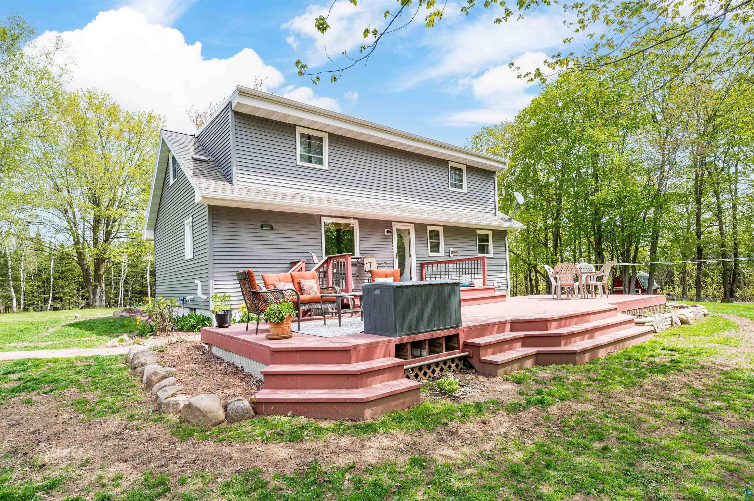Rear view of property featuring a deck