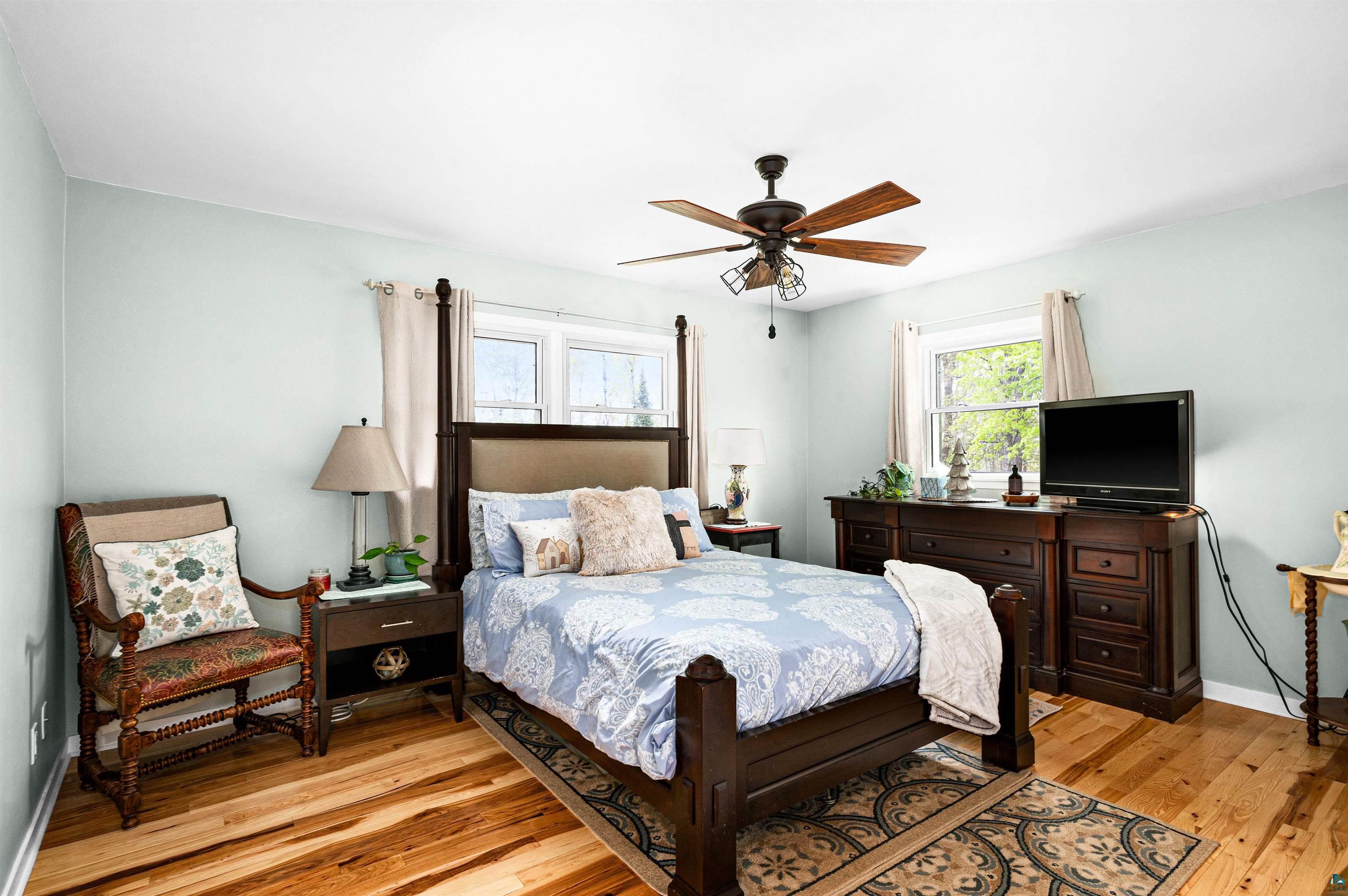 6908 Morris Thomas Road Cloquet, MN 55720 - Photo 19 of 41 Bedroom featuring ceiling fan and light hardwood / wood-style flooring