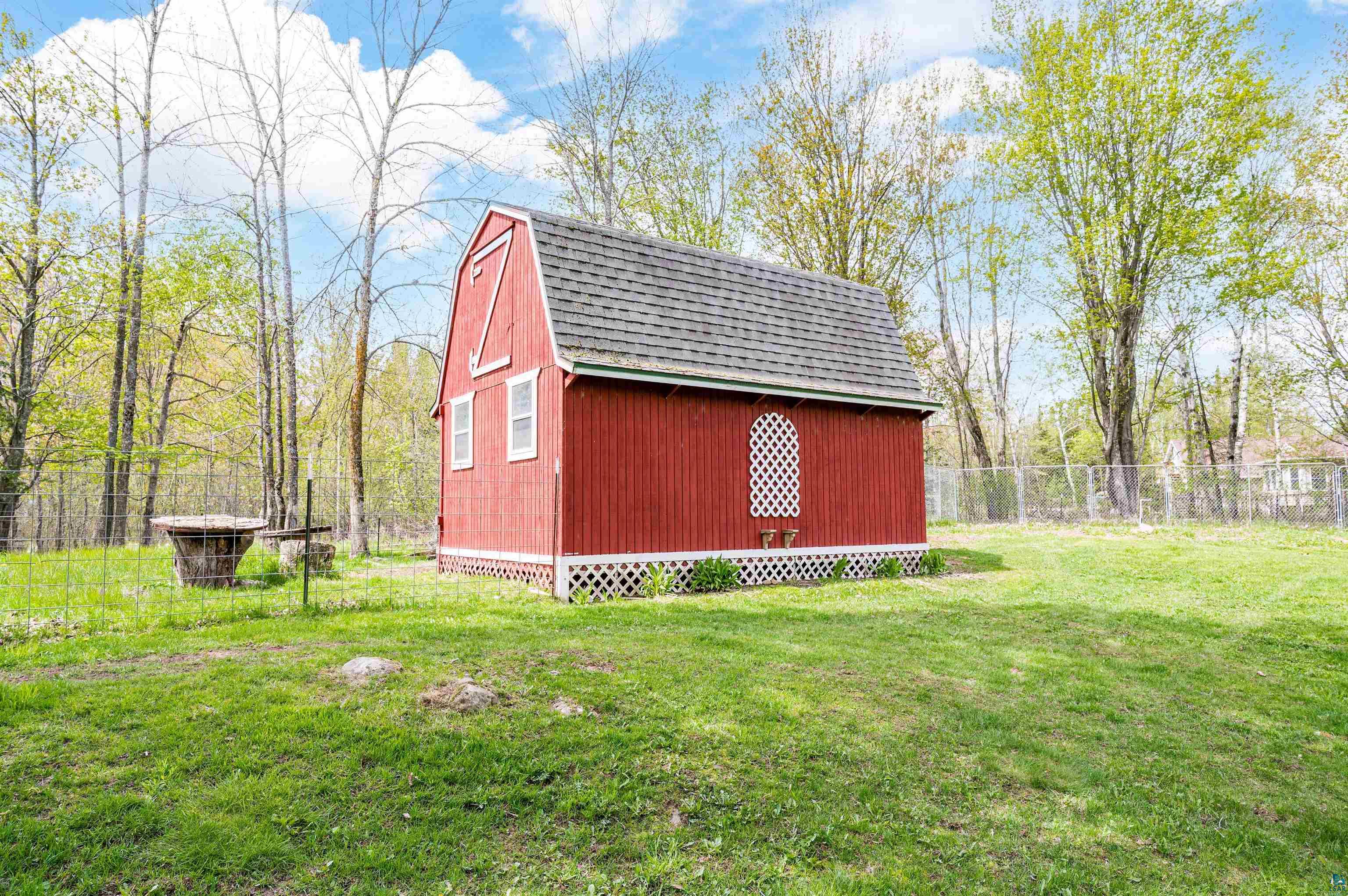 6908 Morris Thomas Road Cloquet, MN 55720 - Photo 29 of 41 View of shed / structure with a yard