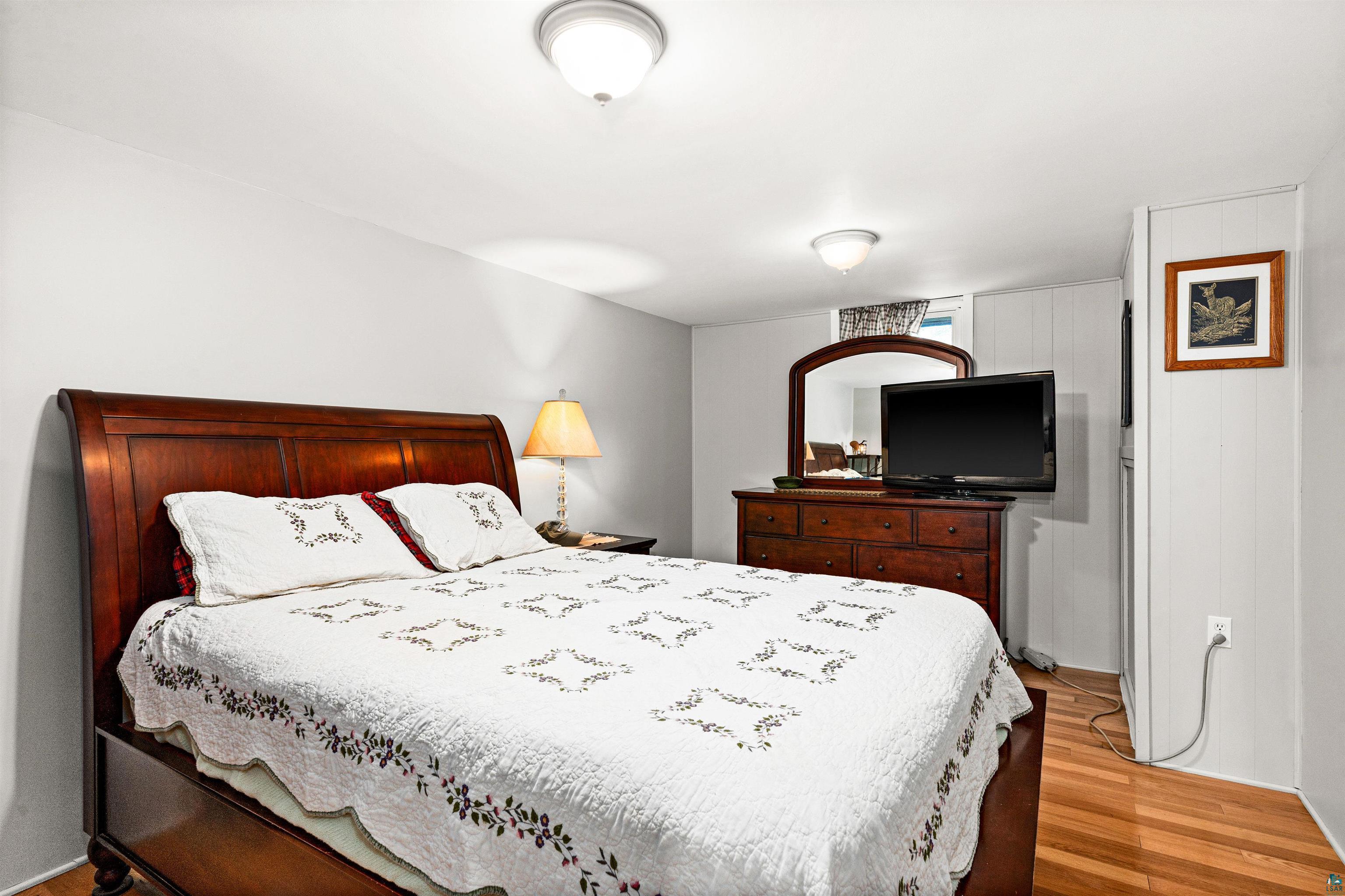 6908 Morris Thomas Road Cloquet, MN 55720 - Photo 37 of 41 Bedroom featuring hardwood / wood-style flooring