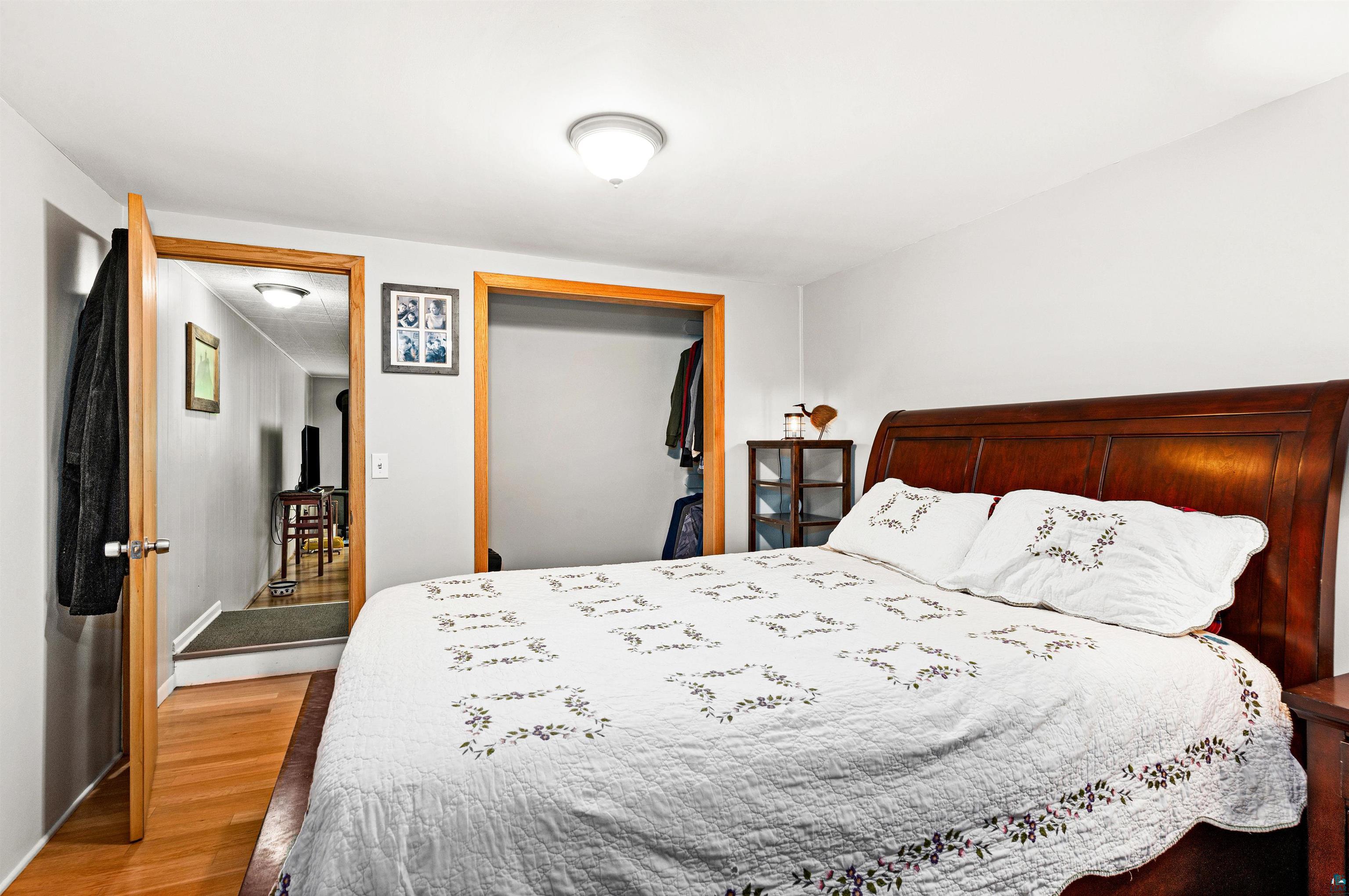 6908 Morris Thomas Road Cloquet, MN 55720 - Photo 38 of 41 Bedroom featuring hardwood / wood-style floors and a closet