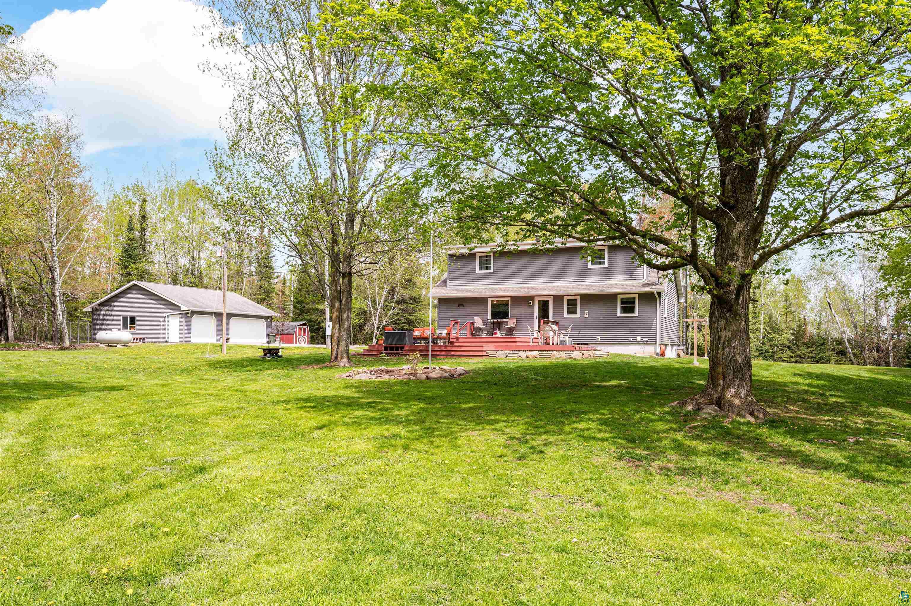 View of yard with a wooden deck