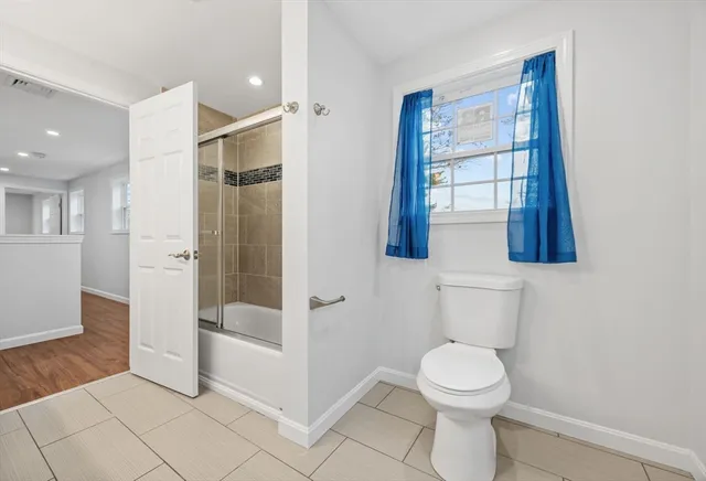 a picture of a bench in front of a wall