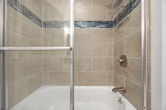 a picture of a bench in front of a wall