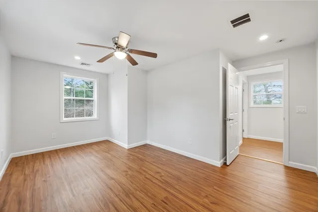 a picture of a bench in front of a wall