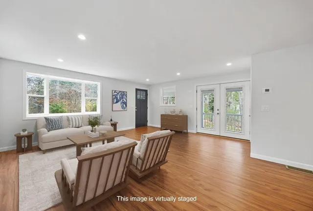 a kitchen with granite countertop a sink stove and cabinets
