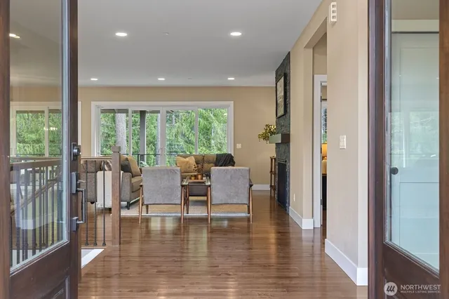 a view of dining room with furniture and wooden floor