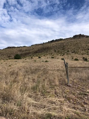 a view of a large building with a mountain in the background