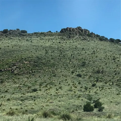 a view of a large body of water with a building in the background