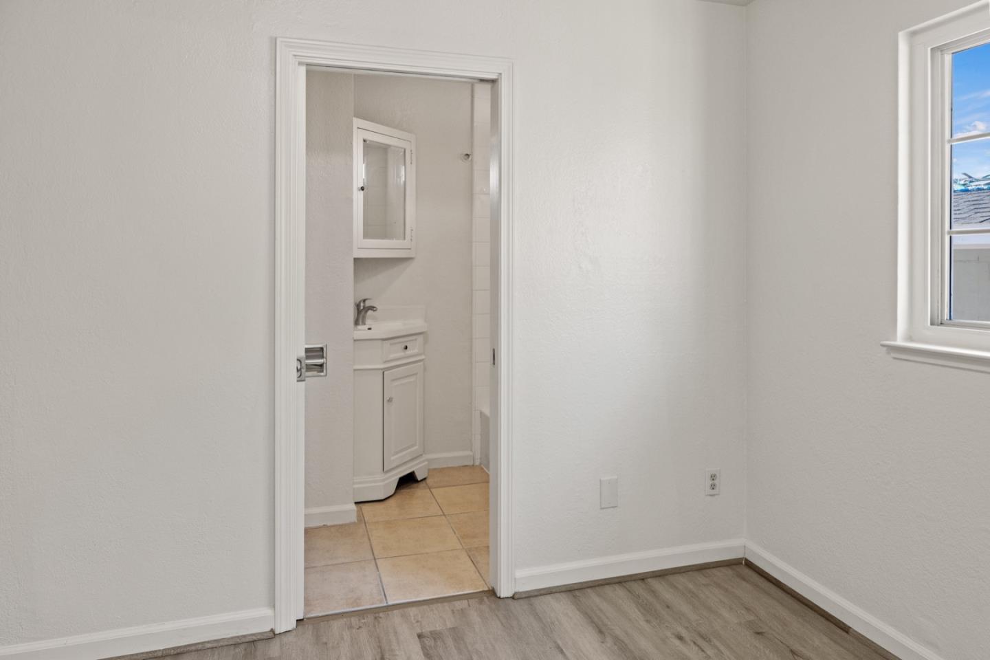 1693 Goodwin Street Seaside, CA 93955 - Photo 18 of 43 an empty room that has a mirror