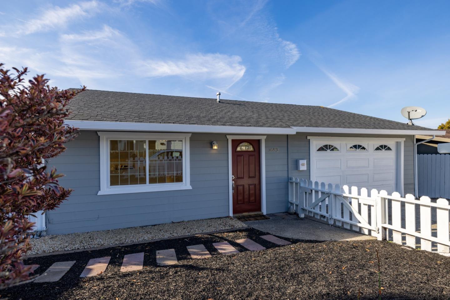 1693 Goodwin Street Seaside, CA 93955 - Photo 2 of 43 a front view of a house with a yard