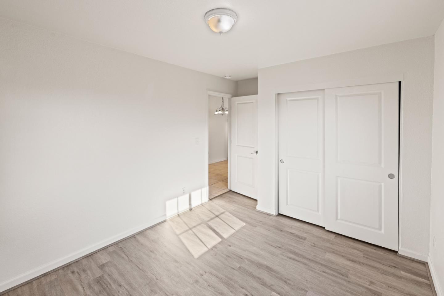 1693 Goodwin Street Seaside, CA 93955 - Photo 23 of 43 a view of an empty room and wooden floor