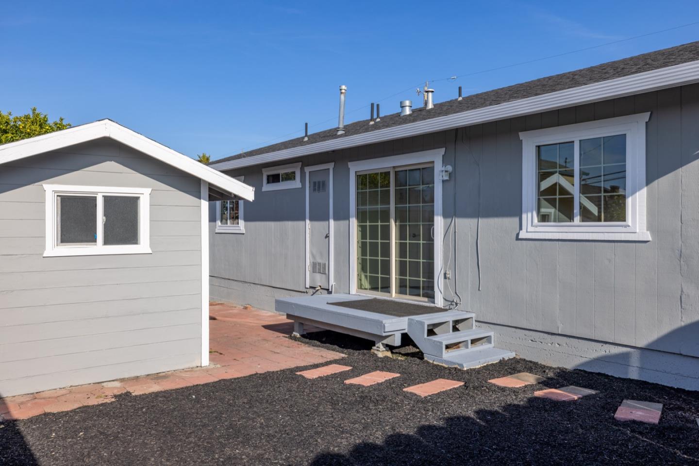 1693 Goodwin Street Seaside, CA 93955 - Photo 35 of 43 a front view of a house with a yard