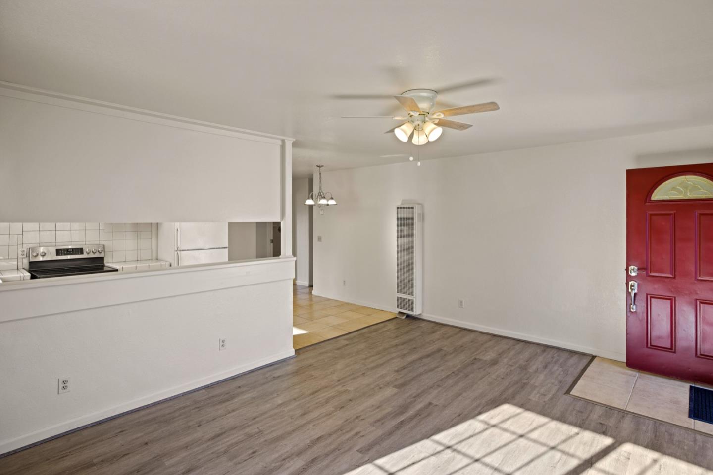 1693 Goodwin Street Seaside, CA 93955 - Photo 5 of 43 a kitchen with a sink cabinets and wooden floor