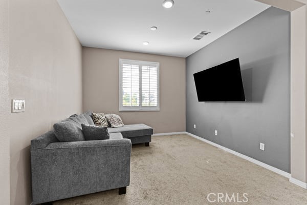 23347 Crystal Way Wildomar, CA 92595 - Photo 11 of 32 a living room with furniture and a flat screen tv