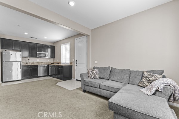 23347 Crystal Way Wildomar, CA 92595 - Photo 13 of 32 a living room with furniture and kitchen view