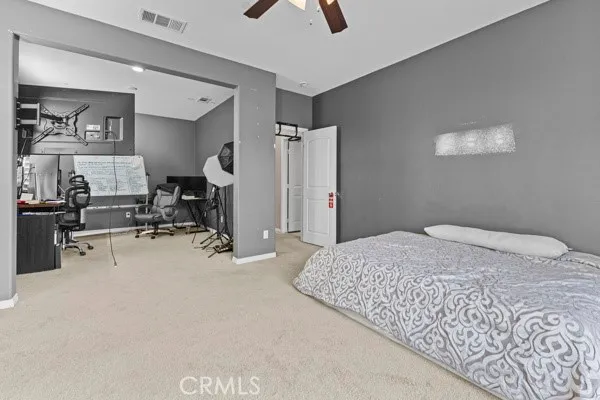 a bedroom with a bed and furniture