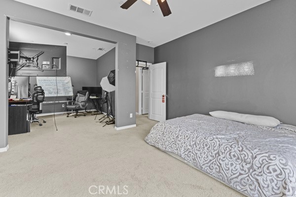 23347 Crystal Way Wildomar, CA 92595 - Photo 14 of 32 a bedroom with a bed and furniture