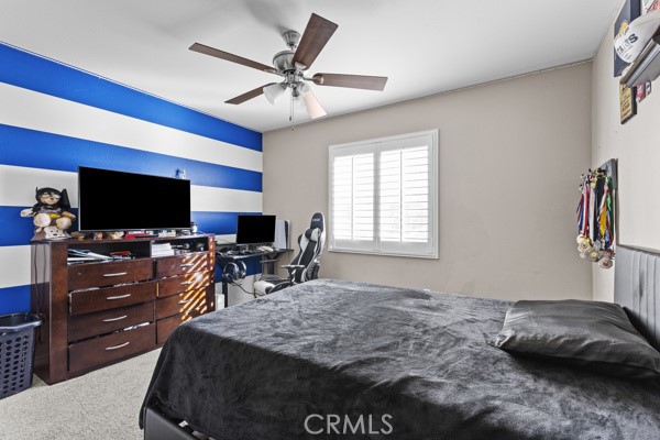 23347 Crystal Way Wildomar, CA 92595 - Photo 18 of 29 a bedroom with furniture and a flat screen tv