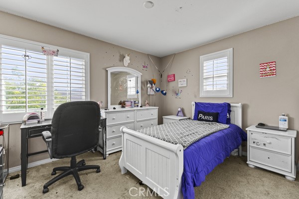 23347 Crystal Way Wildomar, CA 92595 - Photo 19 of 32 a bedroom with a bed and a desk