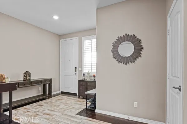 a view of a room with wooden floor and bathroom