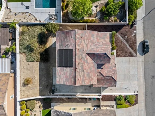 an aerial view of a house with a yard
