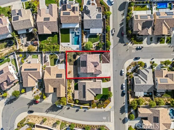 an aerial view of residential houses with city view