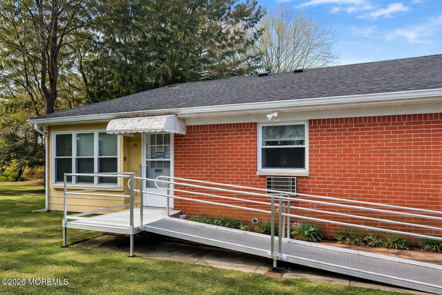 3 Quaker Lane, Unit D Whiting, NJ 08759 - Photo 1 of 9 a view of a house with backyard