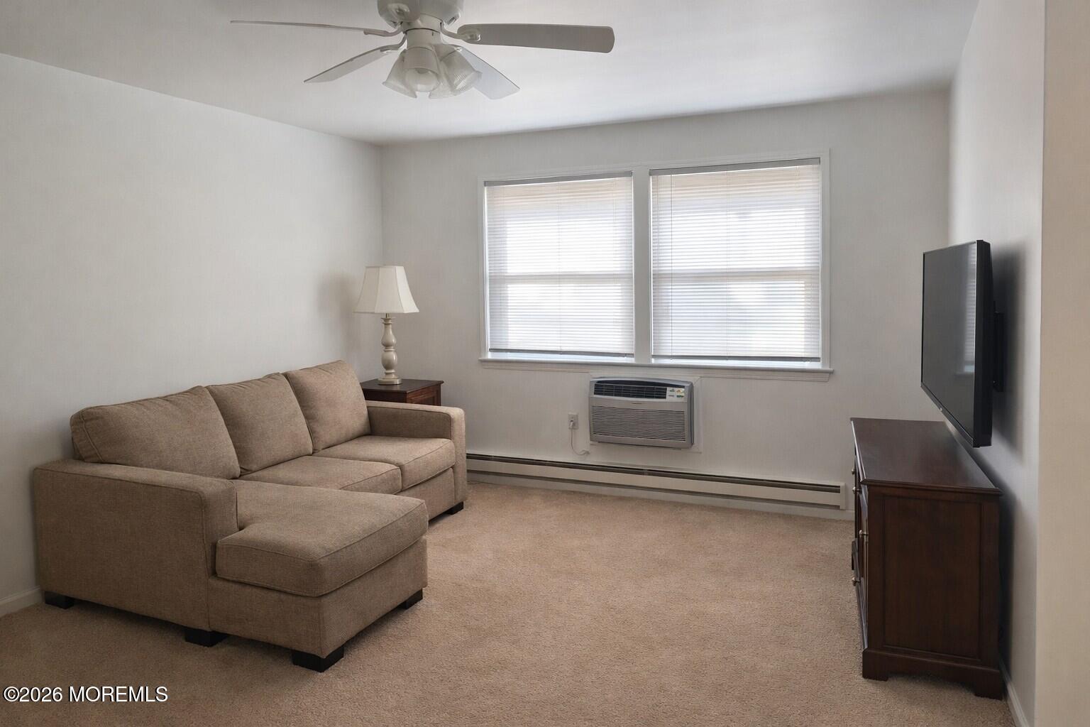 3 Quaker Lane, Unit D Whiting, NJ 08759 - Photo 3 of 9 a living room with furniture and a flat screen tv