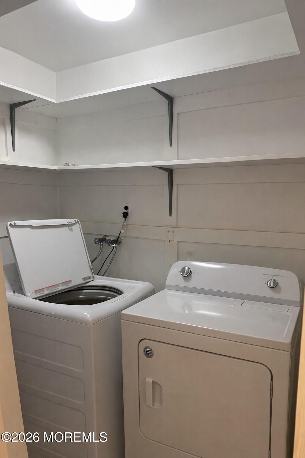3 Quaker Lane, Unit D Whiting, NJ 08759 - Photo 9 of 9 a utility room with dryer and washer