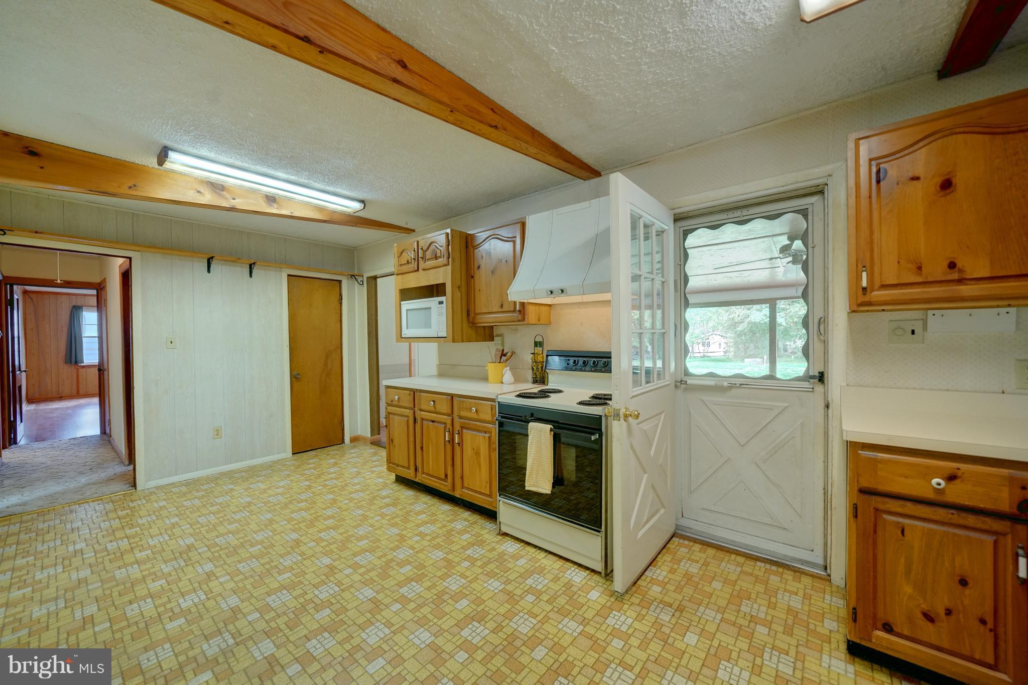 241 Burns Crossing Road Severn, MD 21144 - Photo 15 of 30 a kitchen with stainless steel appliances granite countertop a stove a sink and a refrigerator