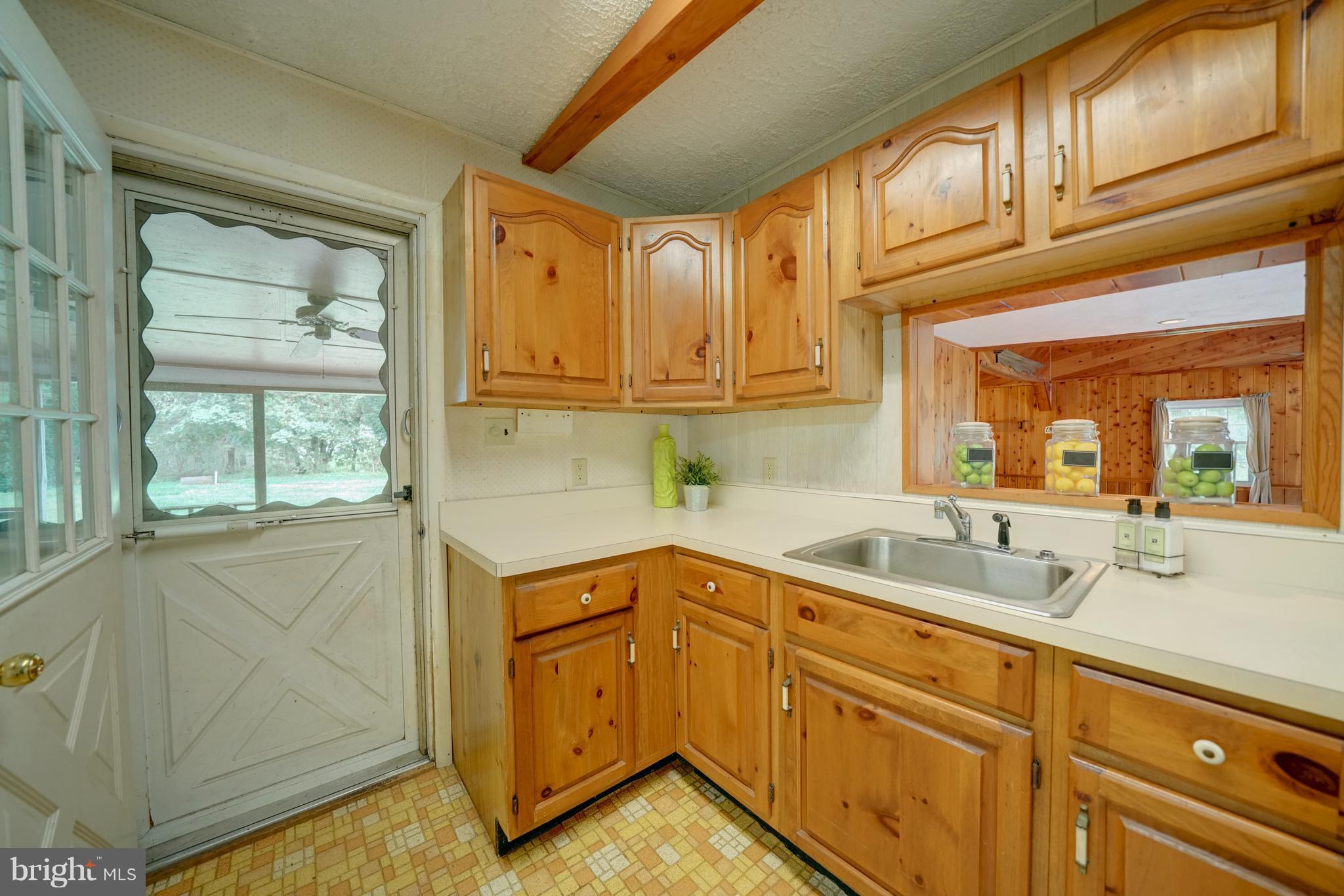 241 Burns Crossing Road Severn, MD 21144 - Photo 16 of 30 a kitchen with stainless steel appliances granite countertop a sink and cabinets with wooden floor