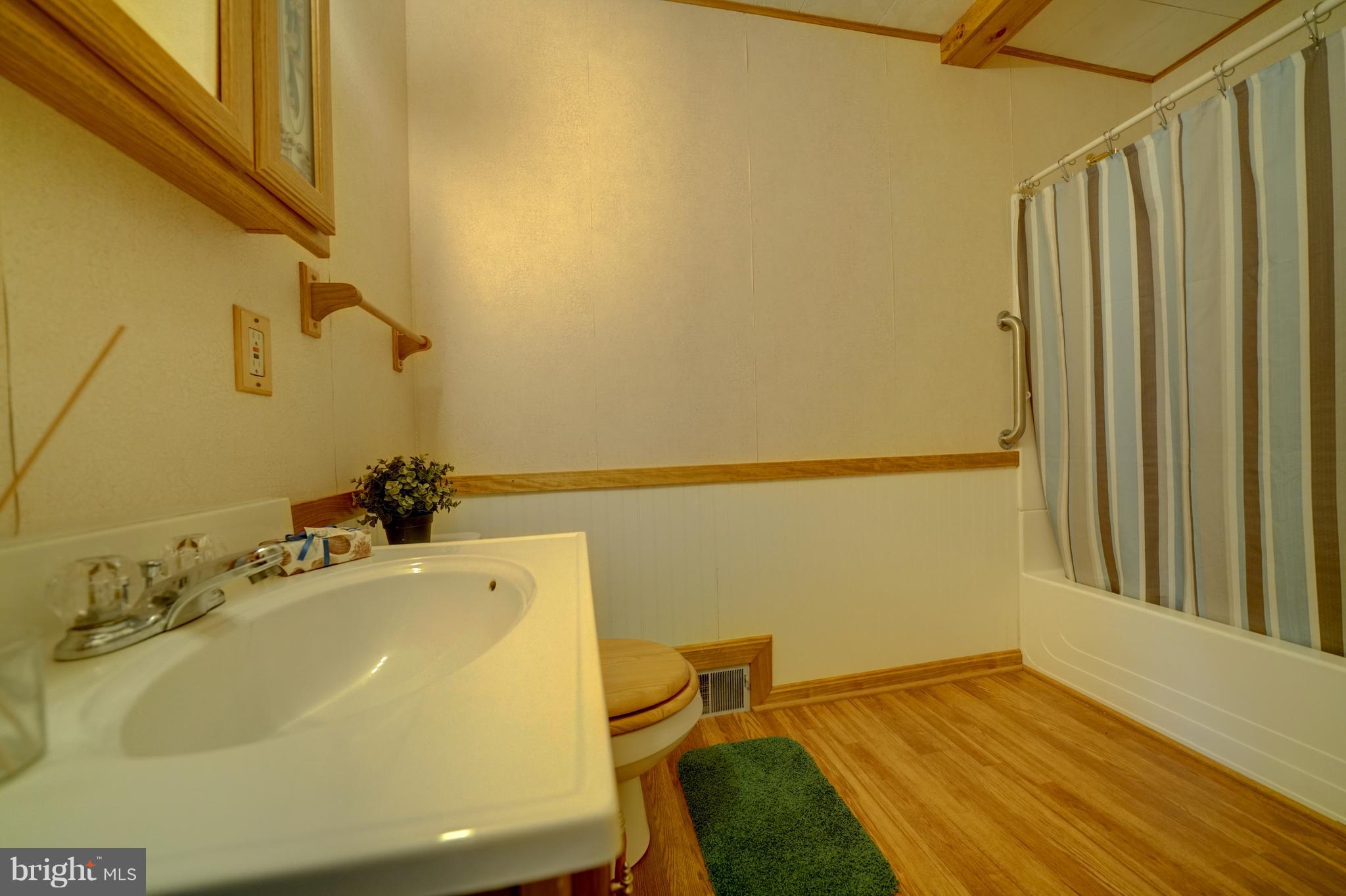 241 Burns Crossing Road Severn, MD 21144 - Photo 25 of 30 a bathroom with a sink and a tub