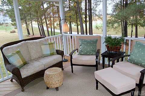 336 Seastone Street Raleigh, NC 27603 - Photo 7 of 12 a balcony with table and chairs