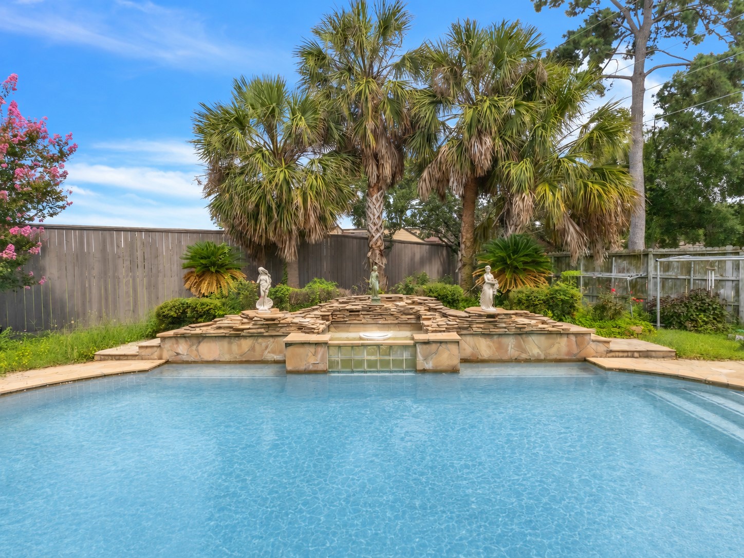 17902 St Emilion Court Spring, TX 77379 - Photo 36 of 38 Backyard with pool inground (pool water color have been edited by AI)