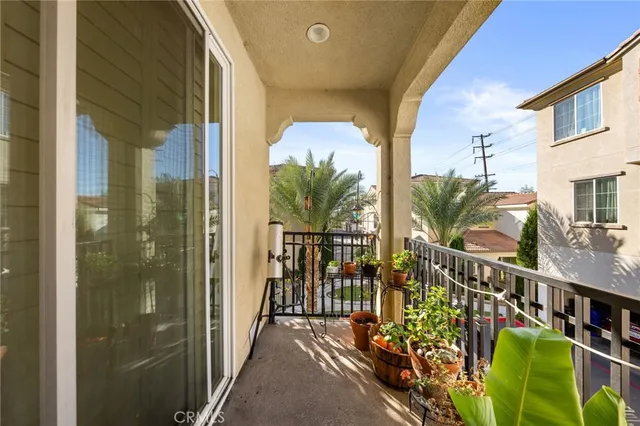 a view of balcony with wooden floor and stairs