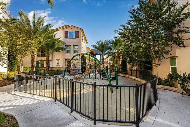 an aerial view of a house with a yard and potted plants