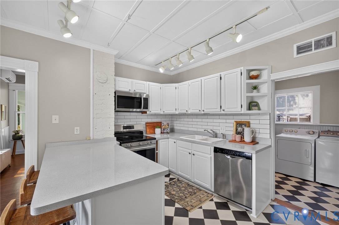 210 Henry Clay Road Ashland, VA 23005 - Photo 15 of 59 White cabinetry with stainless steel appliances, s
