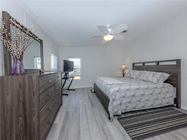 a bedroom with furniture and a window